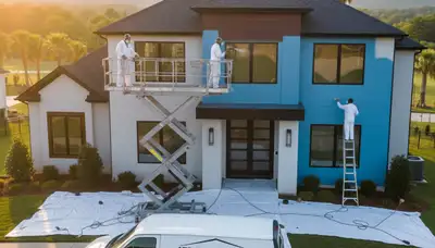 Professional house painters working on residential exterior in Memphis TN